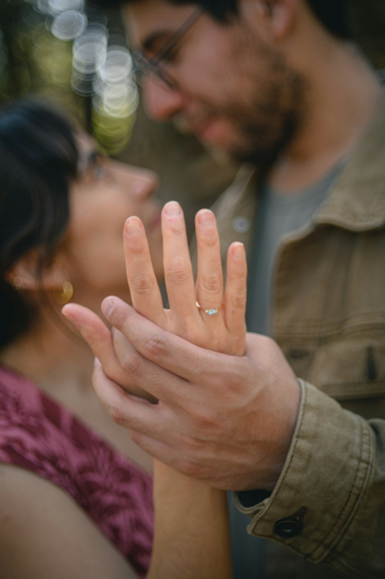 A person showing their engagement ring.
